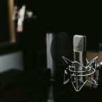 macro photography of silver and black studio microphone condenser